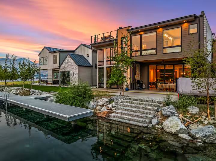 Lakefront luxury short-term rental with private dock at sunset