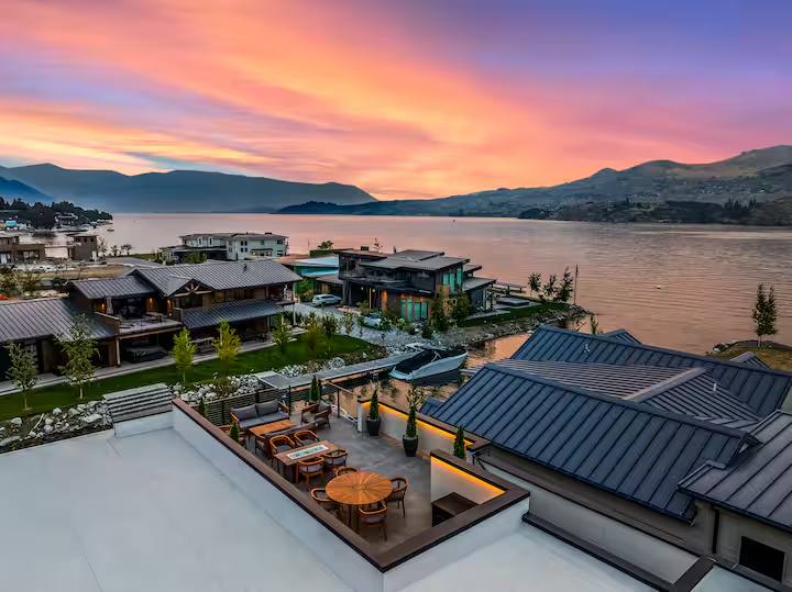 Luxury lakefront short-term rental at sunset financed by Quicker Home Loans